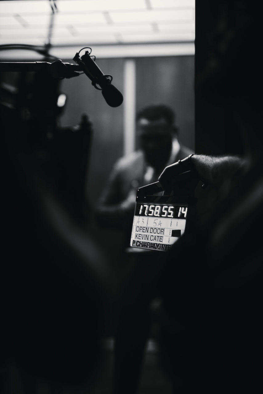 The OPEN DOOR slate on set — directed by Kevin Cate